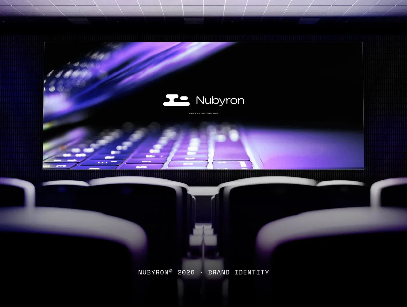 The Nubyron logotype on a large screen in a dark auditorium